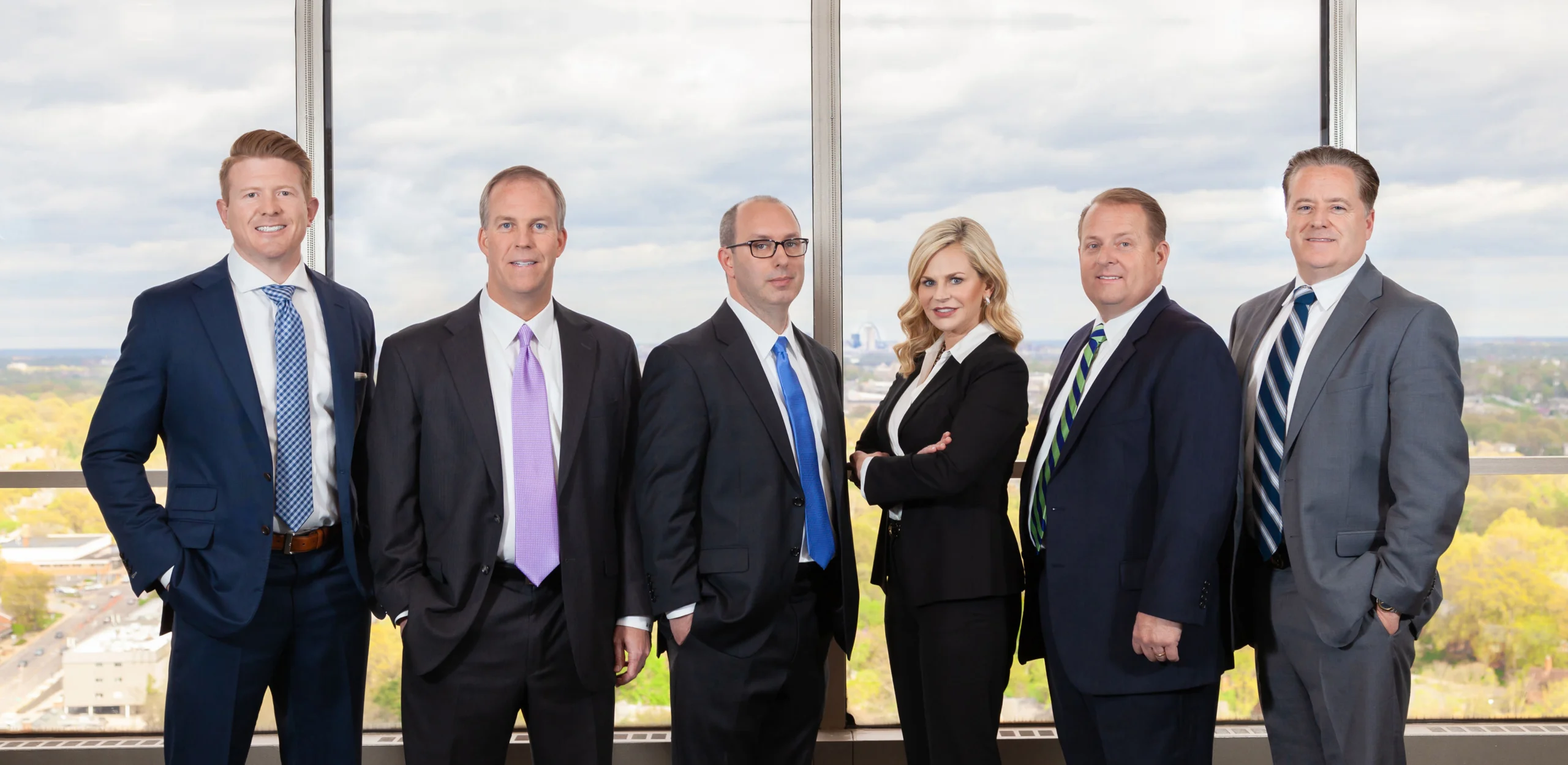 osc-law-group-shot-standing-in-front-of-their-office-window osc law group shot standing in front of their office window