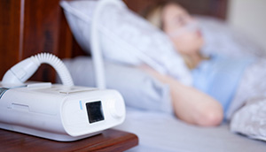 CPAP machine on bedside table
